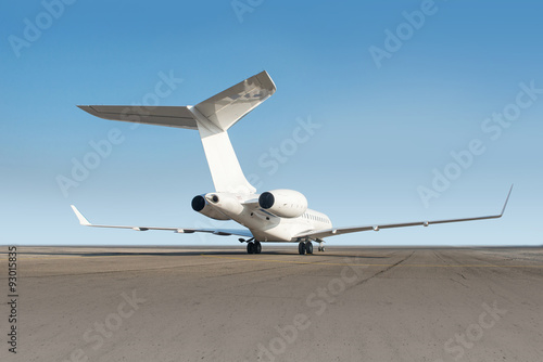 Business jet plane on the ground.