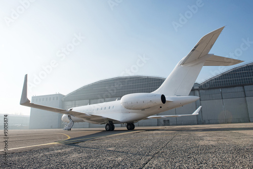 Business jet plane on the ground.