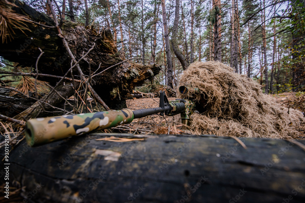 A Camouflaged Sniper Sitting In The Woods Aiming Through His Scope Stock  Photo, Picture and Royalty Free Image. Image 42659284.