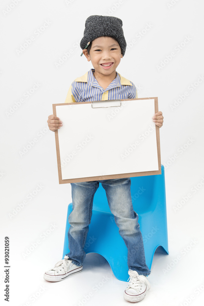 Happy Asian boy holding a blank art board Happy Asian boy holding a blank art board