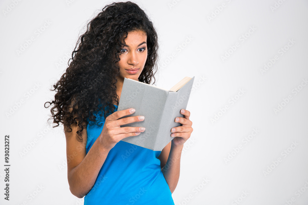 Portrait of a young afro american woman reading book Portrait of a young afro american woman reading book