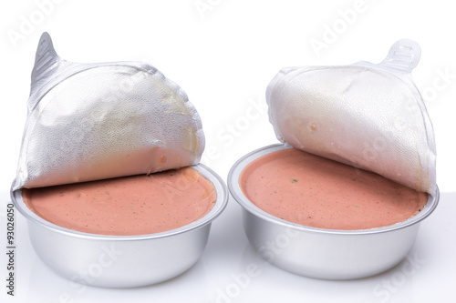 Pate in a metal jar isolated on white