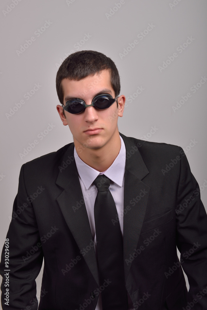 Successful businessman wearing goggles for water, thinking at va Successful businessman wearing goggles for water, thinking at va