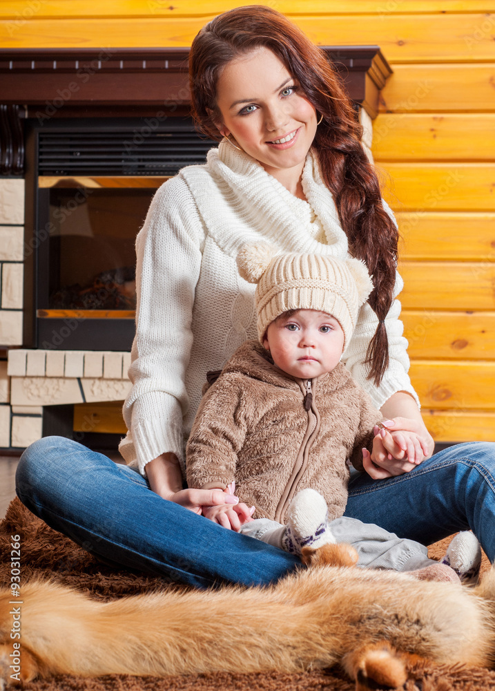 Obraz premium Mother and baby playing and smiling. Happy family.Home interior.