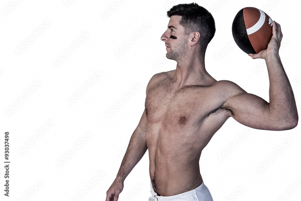 Shirtless rugby player ready to throw the ball Shirtless rugby player ready to throw the ball