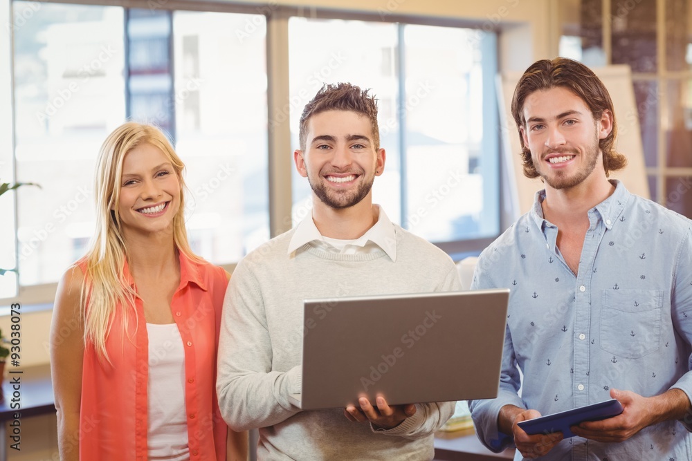 Happy business people using laptop