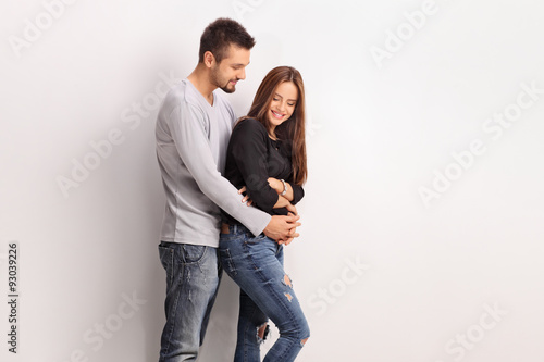 Young romantic couple hugging and posing
