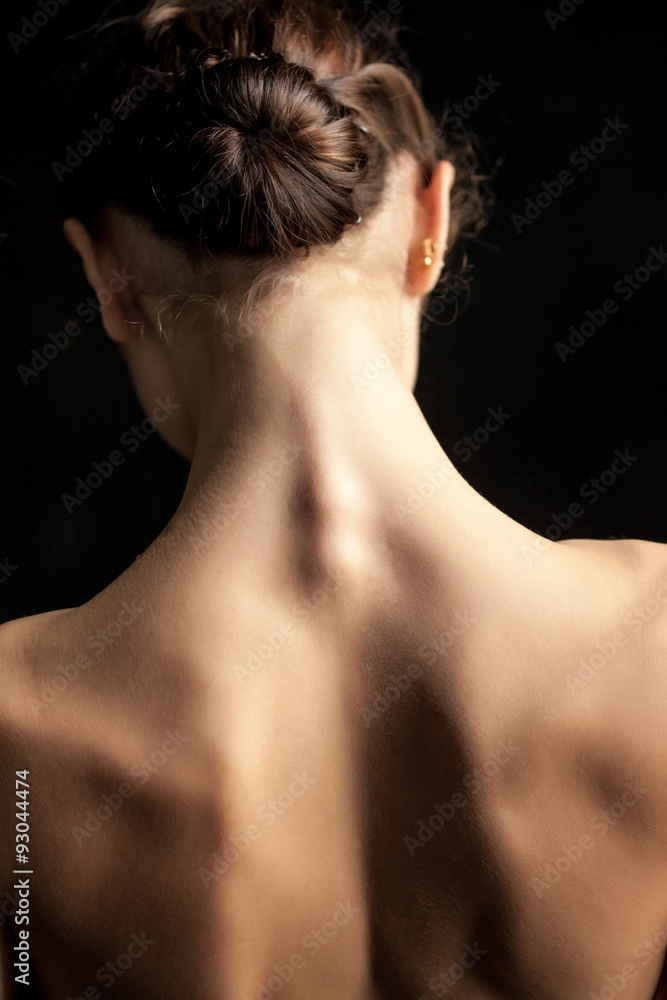Beautiful woman, back view on dack background Beautiful woman, back view on dack background