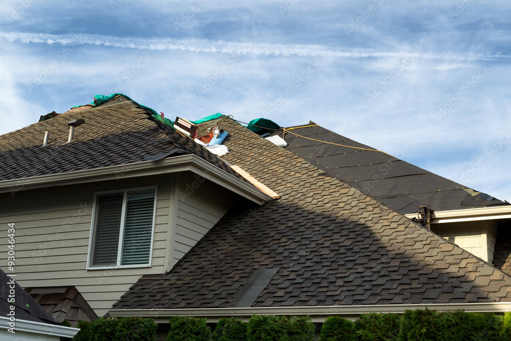 Home roof being replaced with new composite roofing materials Home roof being replaced with new composite roofing materials