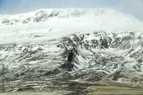 Snow-covered volcanic mountain landscape in Iceland © BirgitKorber