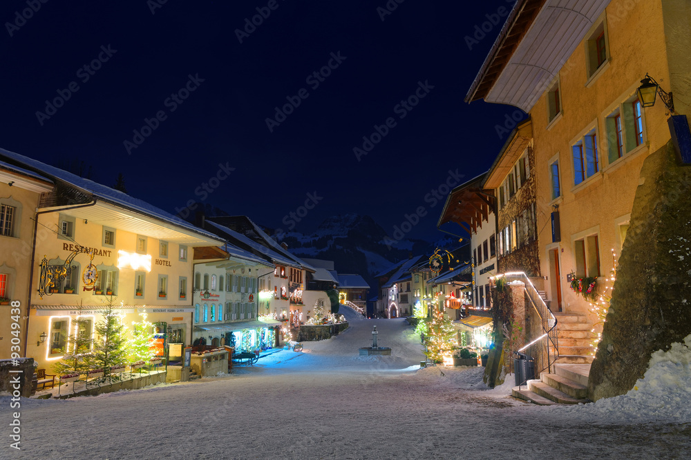 Picturesque winter night view of the medieval town of Gruyeres