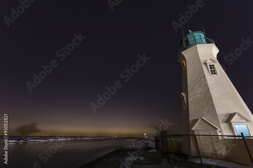 Port Dalhousie Lighthouse at night, the glow of Toronto in the distance.