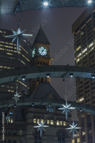 Photography Toronto's Clock Tower from Nathan Phillips Square in downtown Toronto during the holiday season