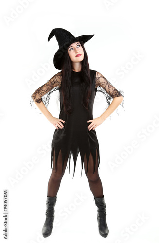 Young brunette witch isolated on a white