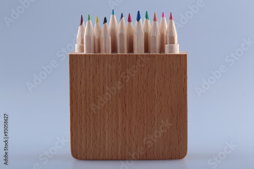 Set of colored pencils in a wooden case. photo