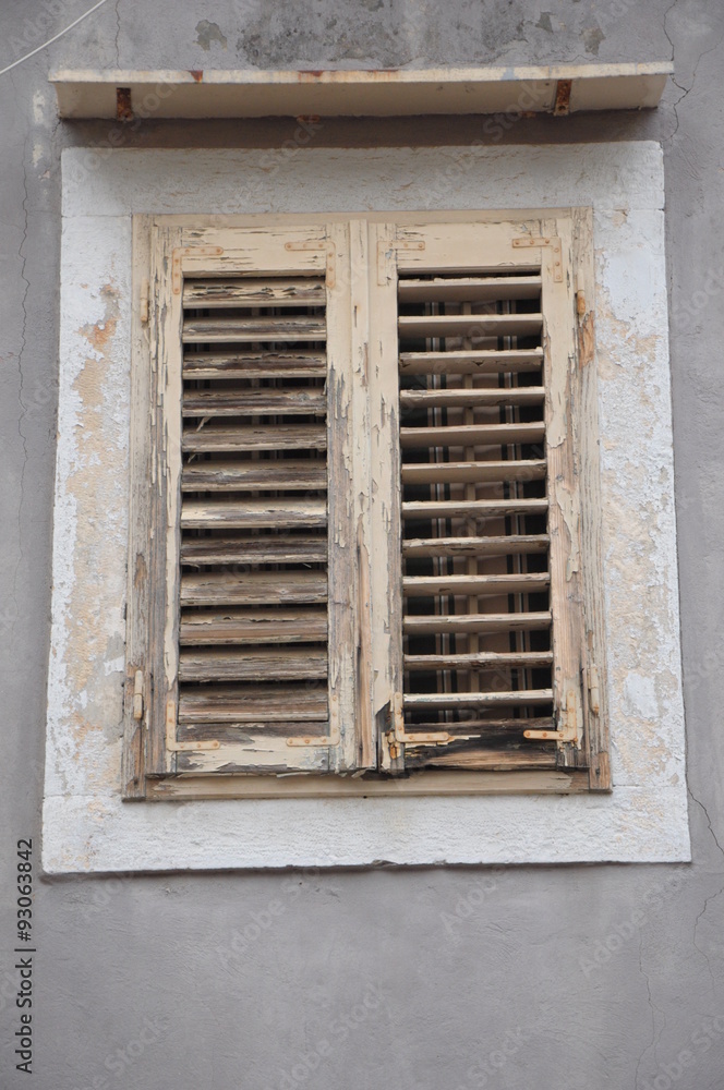 Window with old wooden shutters Window with old wooden shutters