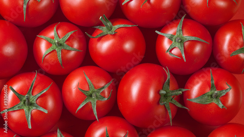red tomatoes background. top view © artjazz