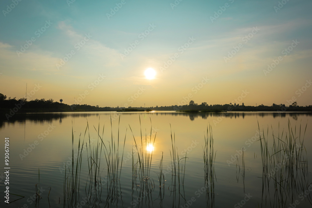 Sunset landscape at the calm lake
