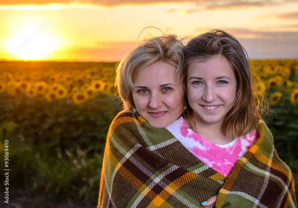 Mother and Daughter on Country Road at Sunset Mother and Daughter on Country Road at Sunset
