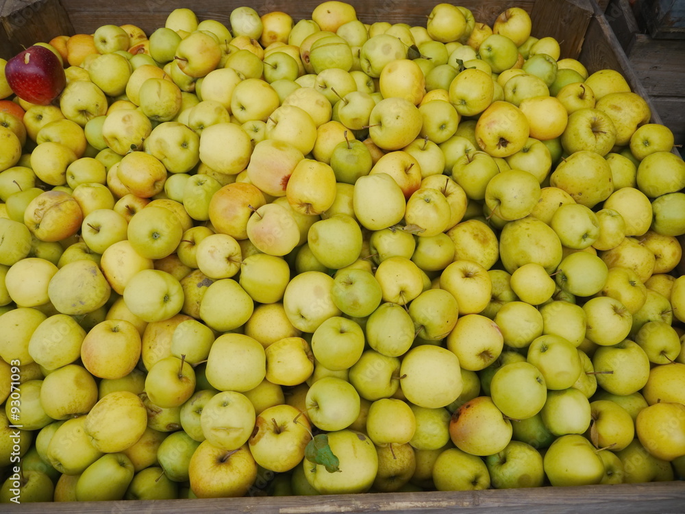 many apples in wooden boxes