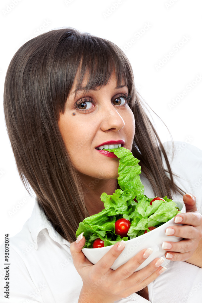 Young woman eating fresh salad Young woman eating fresh salad