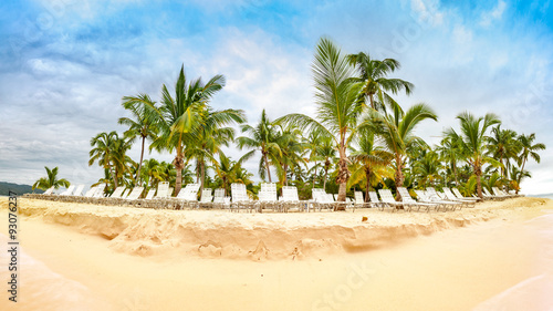 Public beach with palm trees in Cayo Levantado island, Dominican Republic