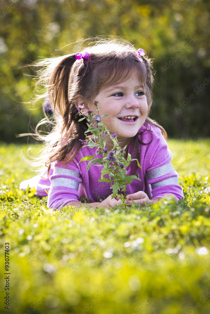 portrait of a little girl in the park portrait of a little girl in the park