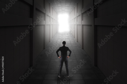 businessman standing in light of opened door