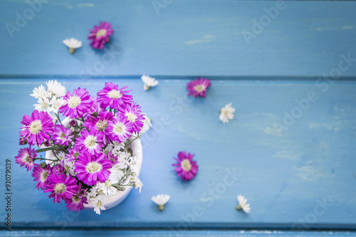 flowers on blue wooden table