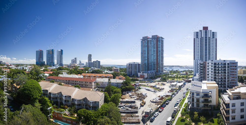 Fototapeta premium Image of a street with cars on each side and many buildings