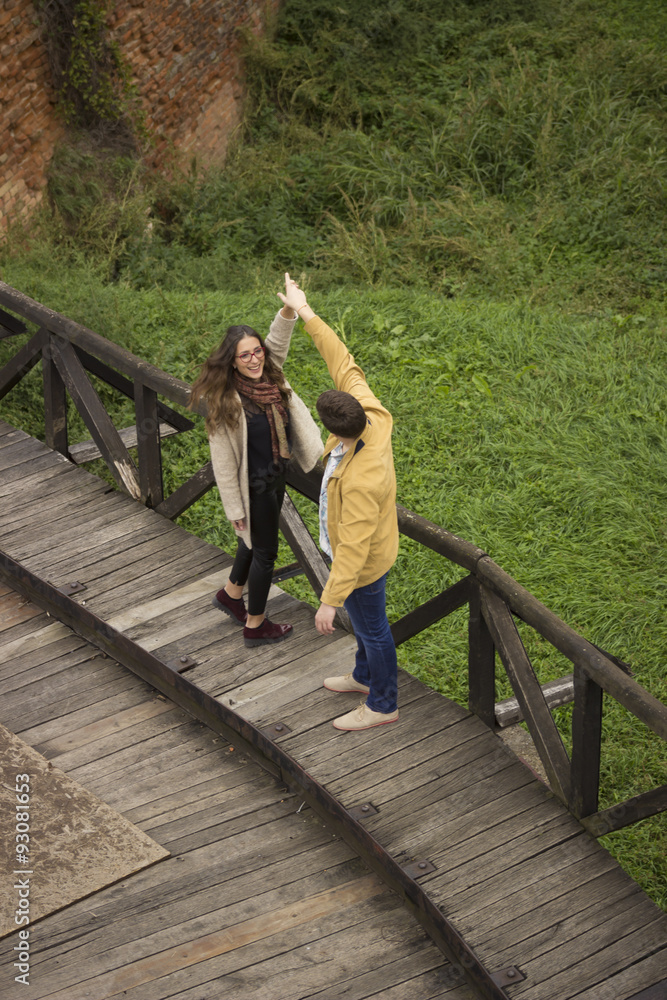 Boyfriend having fun with girlfriends, playful and dancing.