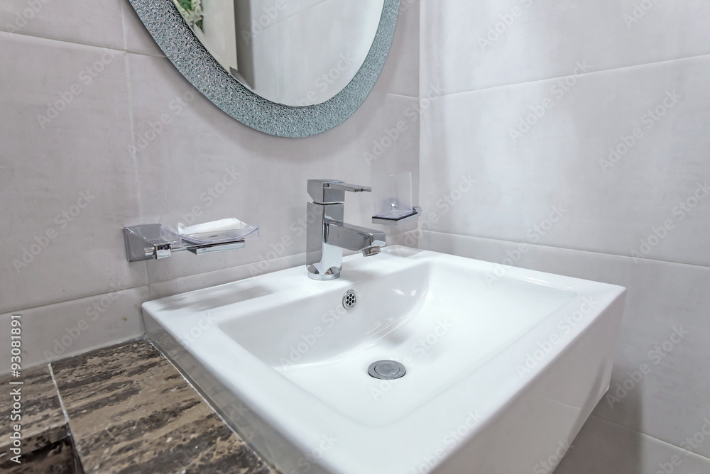 Fototapeta premium white basins in bathroom interior with granitic tiles