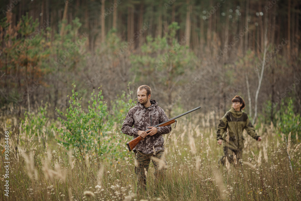 hunters in camouflage clothes ready to hunt with hunting gun hunters in camouflage clothes ready to hunt with hunting gun