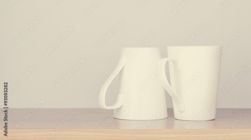 White empty coffee cup in kitchen cabinet White empty coffee cup in kitchen cabinet