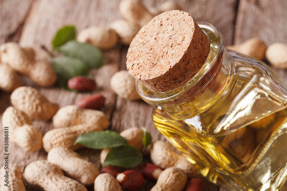 Healthy peanut oil in a jar macro. horizontal
Healthy peanut oil in a jar macro. horizontal