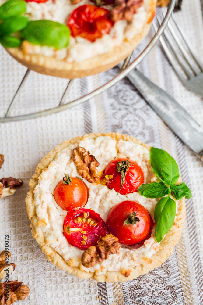 quiche with goat cheese, cherry tomatoes and walnuts, vegetarian