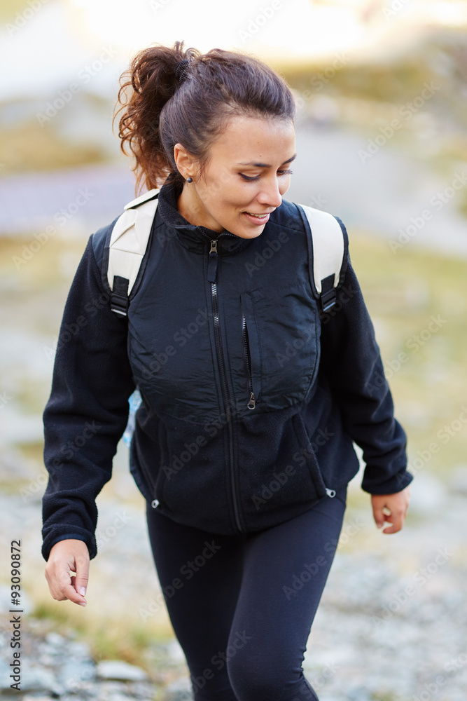 Fototapeta premium Woman hiker on a trail