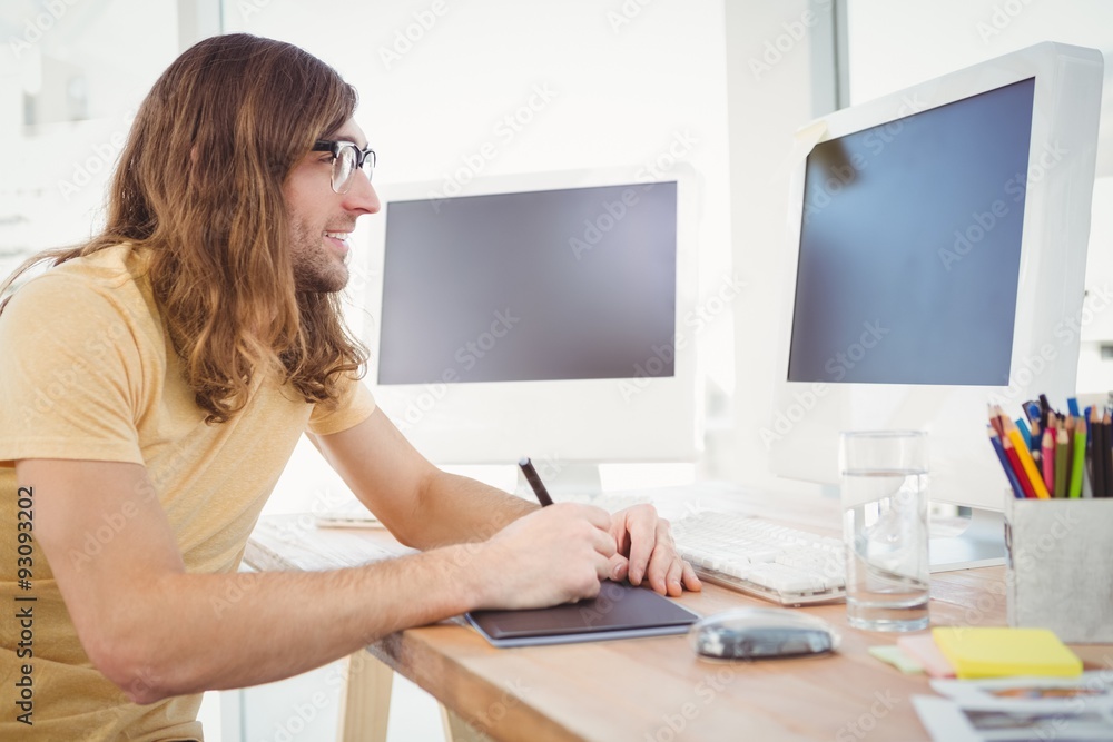 Hipster working on graphics tablet Hipster working on graphics tablet