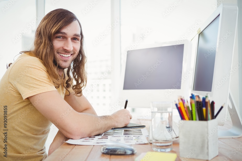 Portrait of happy hipster working at desk Portrait of happy hipster working at desk