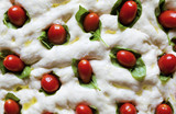 food pizza pattern.raw pizza dough close-up. with cherry tomatoe