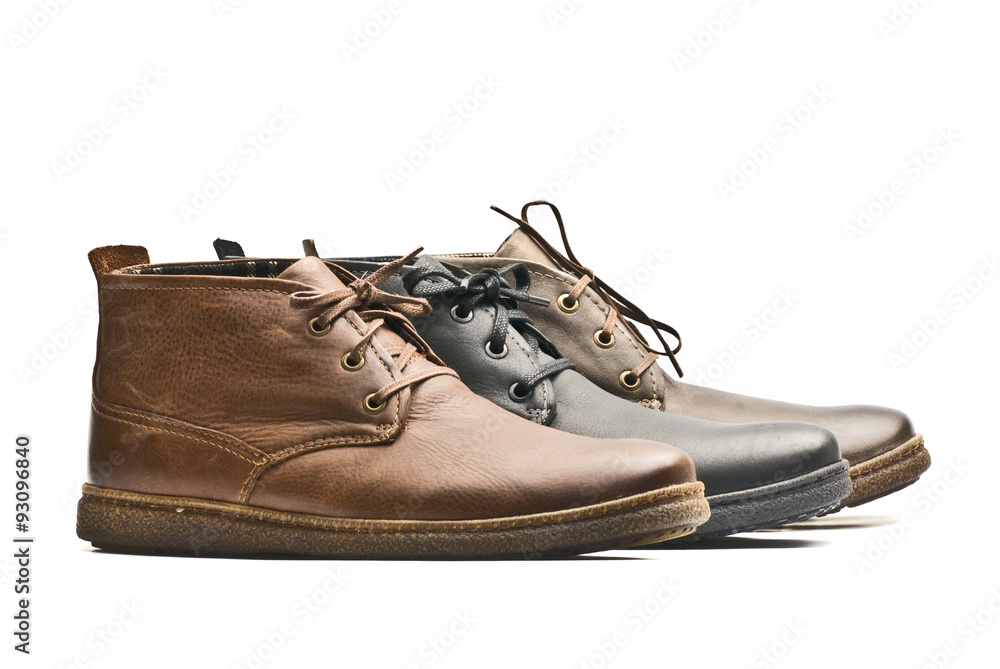 Mens brown and black shoes on white background