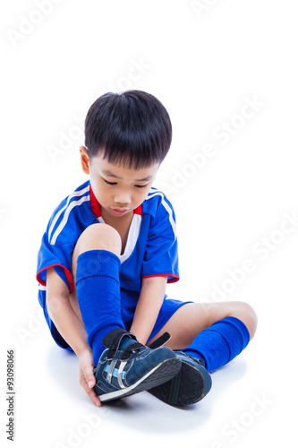 Youth child tying shoe and prepare for competition. Full body