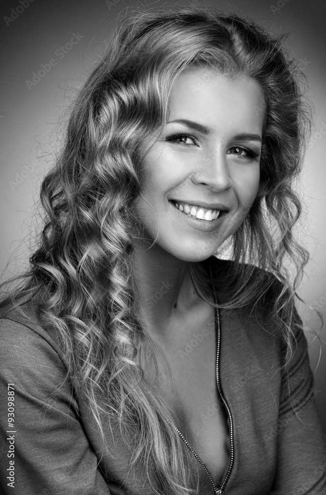Smiling blonde with long curly hair. Smiling blonde with long curly hair.