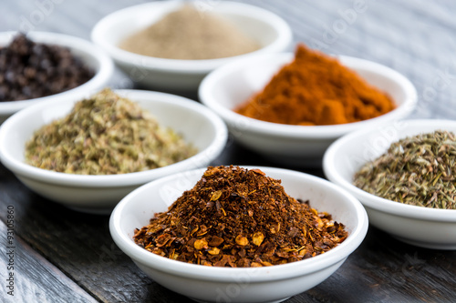 Spices and herbs in bowls.