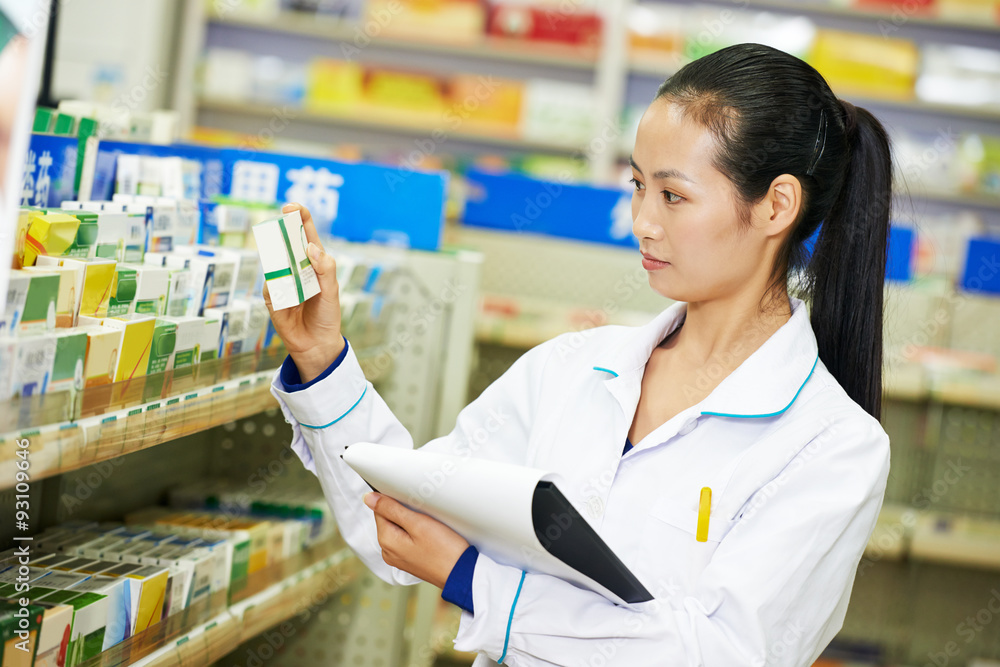 Chinese pharmacy chemist woman in china drugstore