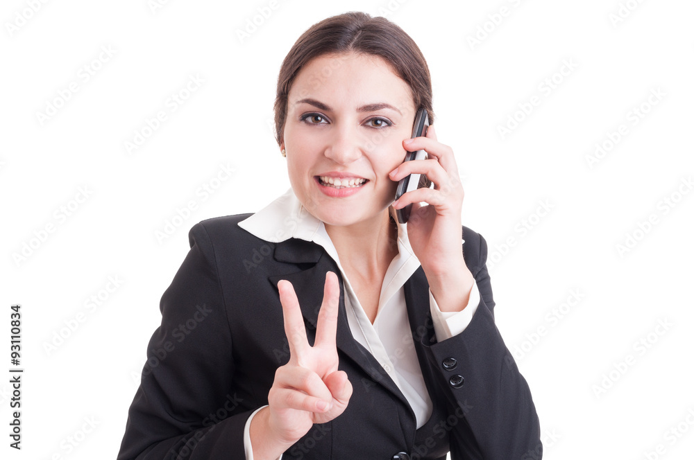 Smiling happy business woman showing victory or peace gesture Smiling happy business woman showing victory or peace gesture