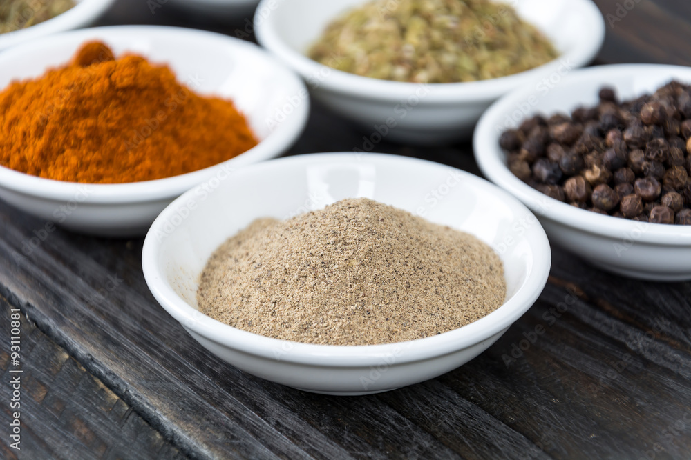Spices and herbs in  bowls.