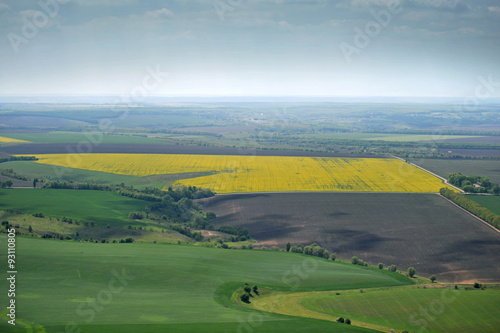 birds eye view of fields with farms and roads