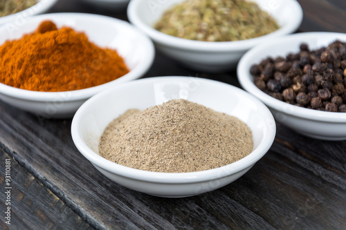 Spices and herbs in bowls.