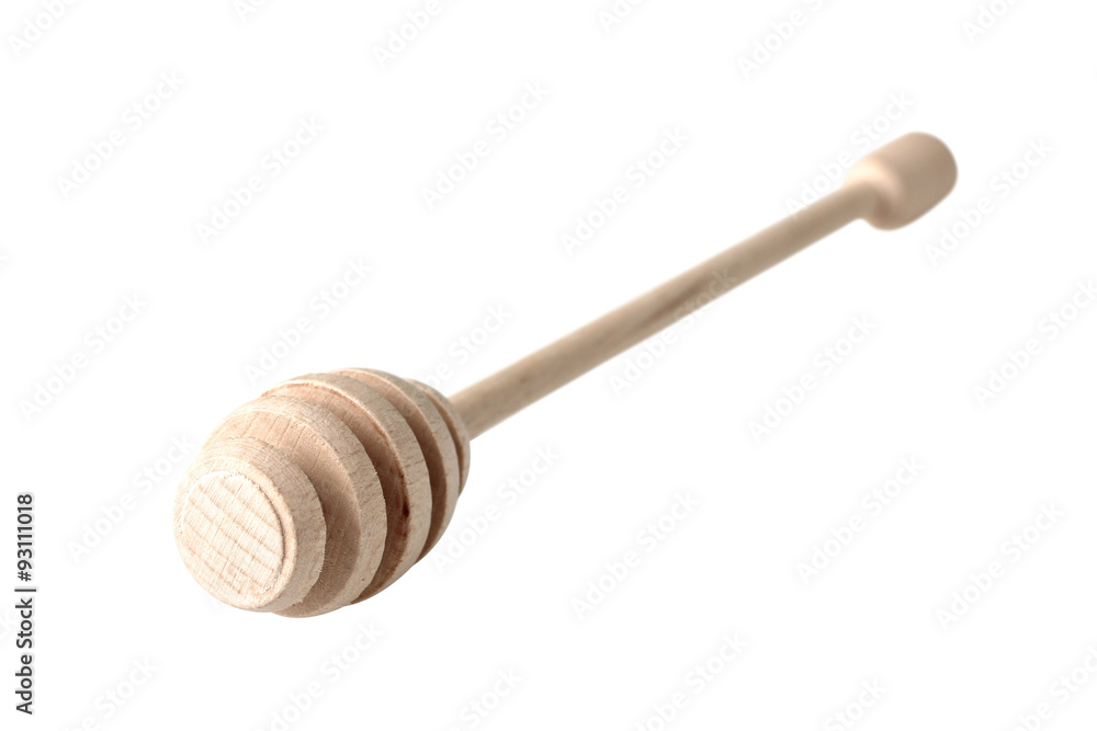 sturdy wooden spoon for honey on a white isolated background